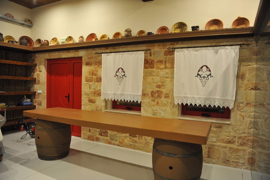 'Piperis Winery' folklore room with short hand-embroidered curtains to the windows